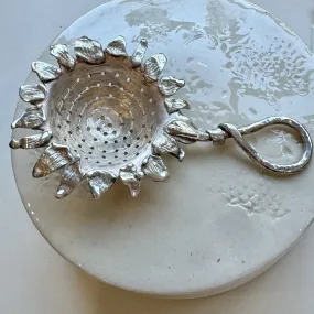 Silver sunflower tea strainer